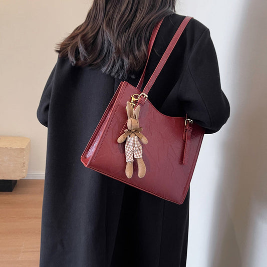 🎅Xmas Sales - 60% OFF🎄Women's Trendy Shoulder Bag with Doll Pendant